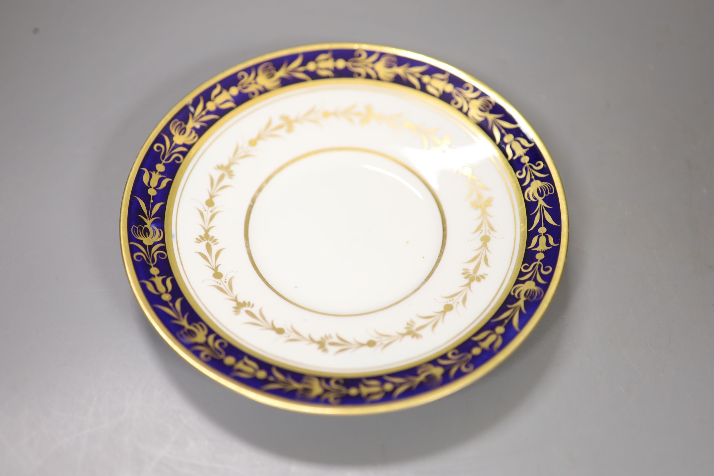 A Flight Barr boat shaped sucrier with brown leaves and gilding above a marbled ground,